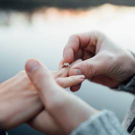 man proposes to his girlfriend during a wedding proposal luxury picnic