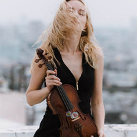 A woman holding her violin